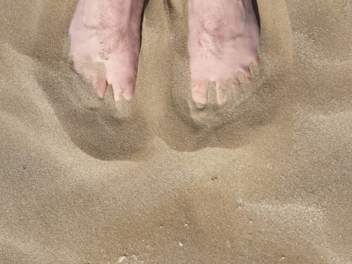 Foot in the sand of Rimini